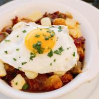 Breakfast Poutine · Lyonnaise-style potatoes with chunks of bacon, sausage, applewood smoked ham and cheese curd...