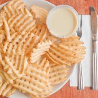 Salt & Pepper Waffle Fries · Add cheese for an additional charge.