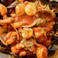 Pescatore · Fresh clams, mussels, shrimp, scallops, and crabmeat over spaghetti.