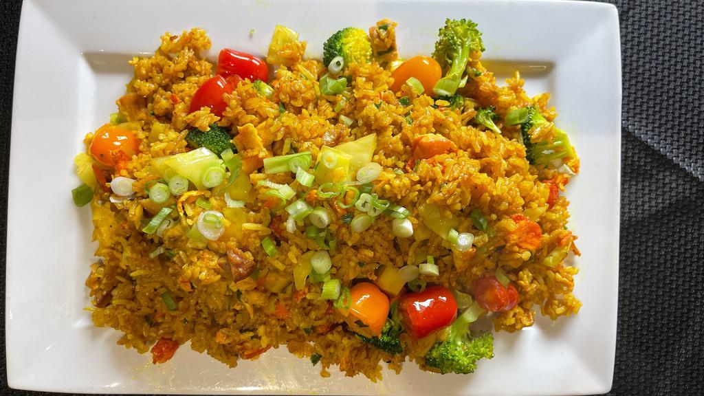 Curry Fried Rice · Choice of chicken, pork, or vegetables fried rice flavored with curry spices.