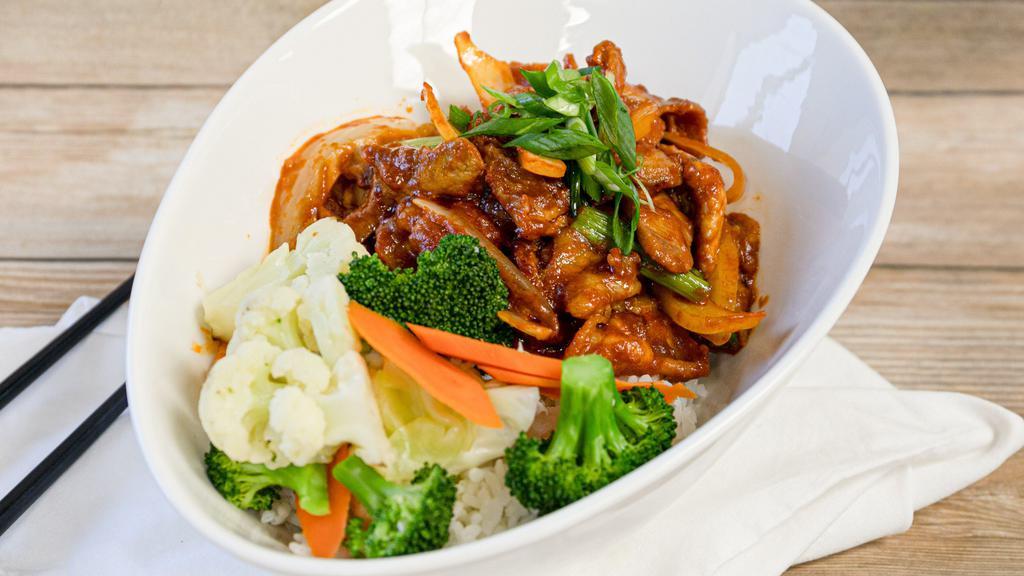 Korean Spicy Pork · Two different cuts of pork sauteed with onions in a spicy and savory gojuchang sauce.