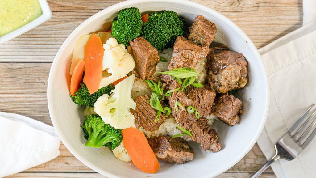 Wine Braised Beef · Thick cuts of beef, marinated in a red wine broth, and slowly braised at a low temperature over a long period of time to preserve tenderness.