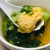 Wonton Soup · Ground chicken wrapped in wonton skin with bok choy and scallions in a clear broth.
