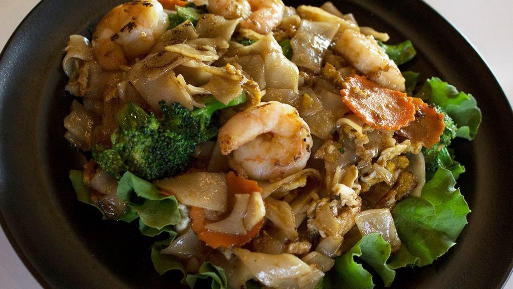Pad See You · Flat noodles with egg, broccoli, and carrots in a sweet soy sauce.