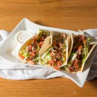 Tacos · Your choice of chicken, beef, or pork tacos with shredded cheddar, shredded lettuce and noel...