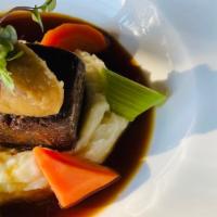 Short Rib · Short rib served on a bed of mashed potatoes, with apple purée and brandy sauce.