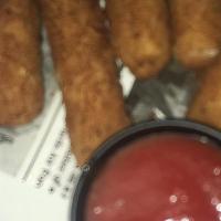 Cheesy Mozzarella Sticks · Crispy on the outside, hot and gooey on the inside. Served with marinara sauce.