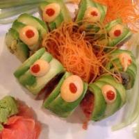 Godzilla Roll · Spicy tuna crunch wrapped with avocado and topped with spicy sauce.