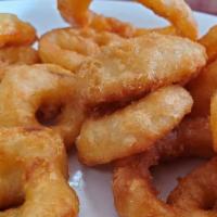Onion Rings · 10 battered onion rings fried golden brown.