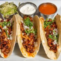 Tacos · Three tacos, soft or hard shell. Lettuce and sour cream on the side