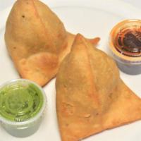 Vegetable Samosa (2) · Vegetarian. Peas and potatoes in a spicy red curry sauce are folded into white Flour wrapper...