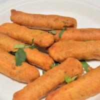 Paneer Pakora (6) · Vegetarian. Thick fingers of cheese stuffed with spicy chutney, dipped in gram flour batter ...