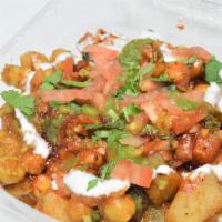 Aloo Chat · Spicy.  A refreshing chat item,  made with fried potatoes,  chickpeas in a yogurt sauce and ...