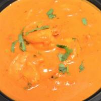 Shrimp Tikka Masala & Rice · Shrimp, onion, bell pepper, garlic cooked with tomato sauce and cream.