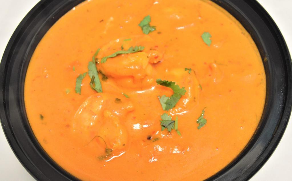 Shrimp Tikka Masala & Rice · Shrimp, onion, bell pepper, garlic cooked with tomato sauce and cream.