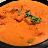 Chicken Tikka Masala & Rice · Chicken cooked with tomato sauce, bell peppers and onions.