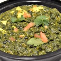 Palak Paneer · Spinach cooked with cheese, onion, tomatoes, ginger, garlic and spices.