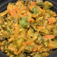 Bhindi Masala & Rice · Vegetarian. Okra sautéed with onions and cooked with tomato sauce and spices.