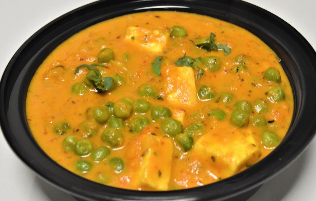 Mutter Paneer & Rice · Vegetarian. Homemade cheese cooked with green peas, onion, tomatoes, ginger-garlic paste, cumin, coriander and spices.