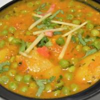 Aloo Mutter & Rice · Vegetarian. Green peas cooked with potatoes, onion, tomatoes, ginger-garlic paste, cumin, co...