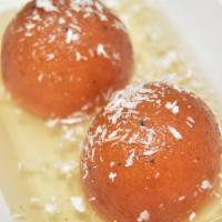 Gulab Jamun (2 Pcs) · Gulab Jamun (2 pcs): Sticky-sweet deep-fried cheese dough balls dipped in a sweet syrup serv...