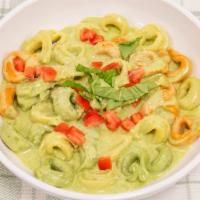 Tortellini Pesto · Tasty cheese tortellini tossed in a house made pesto sauce and topped with fresh Parmesan ch...