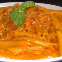 Penne Alla Vodka Pasta · Penne pasta coated in a delicious, creamy vodka sauce, and topped with fresh Parmesan cheese.
