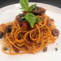 Spaghetti Puttanesca Pasta · Spaghetti with marinara, olives, capers, garlic, and anchovies, and topped with fresh Parmes...