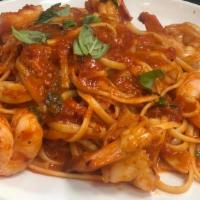 Shrimps Fra'Diavolo · Sautéed with San Marzano tomato sauce, Chili flakes and serve over linguini pasta.