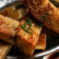 Sarcone’S Seeded Garlic Bread Stix · roasted garlic butter, parmesan, parsley, . + served with a side of marinara