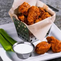 Boneless Wings · Hand-tossed in choice of sauce: house BBQ, buffalo, honey-chipotle. Served with celery and d...
