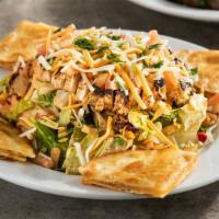 Quesadilla Explosion Salad™ · Favorite. Grilled chicken, cheese, tomatoes, corn, and black bean salsa, tortilla strips wit...