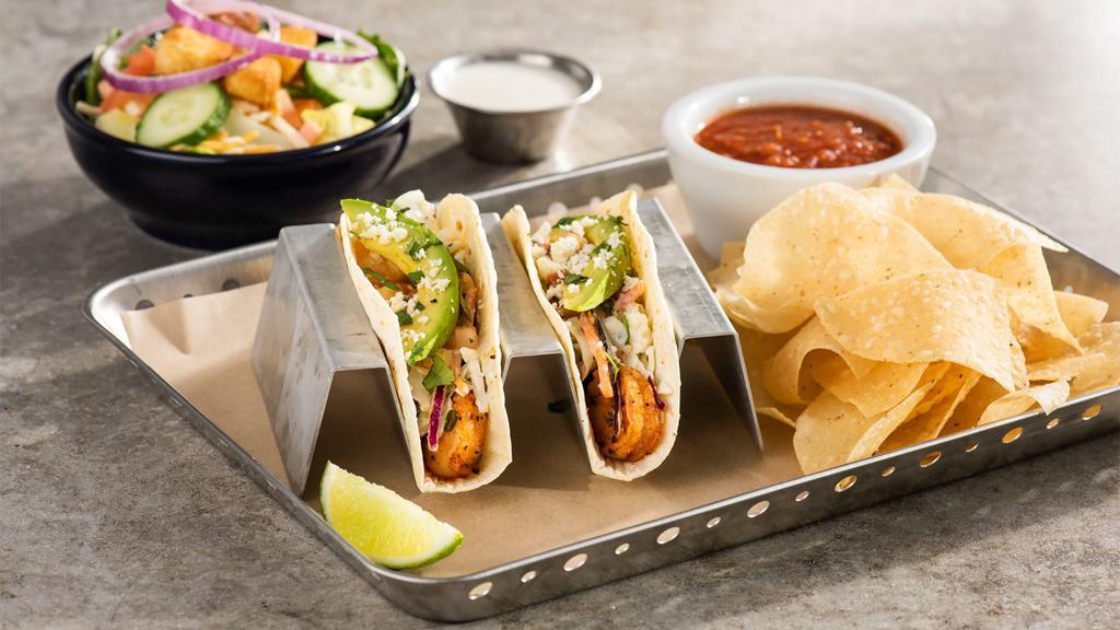 Spicy Shrimp Tacos · Three spicy chile-lime shrimp tacos in flour tortillas with pico, avocado, cilantro, coleslaw, queso fresco. Served with Mexican rice and black beans. 990 cal.