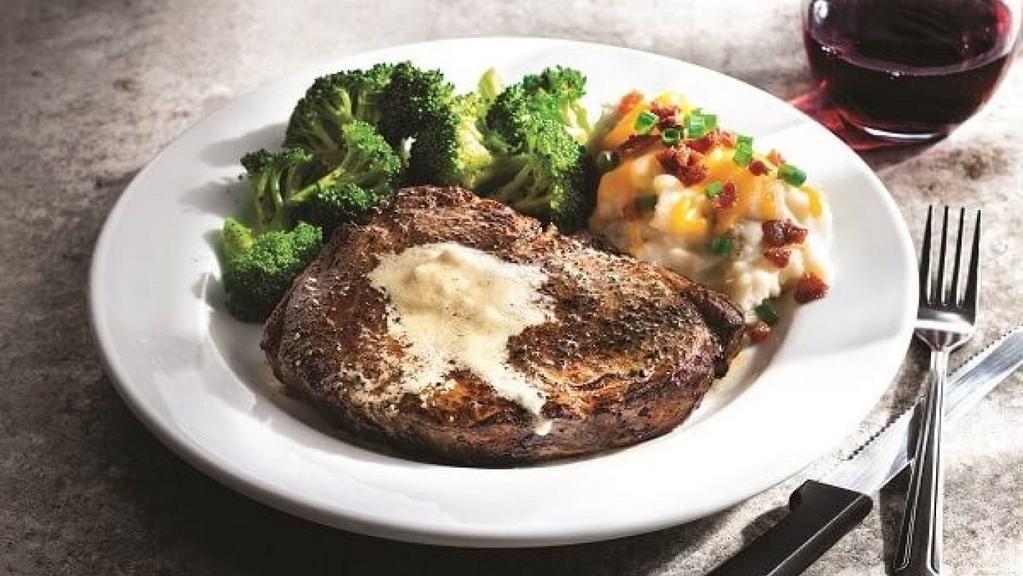 Classic Ribeye · Favorite. Marbled, thick-cut steak topped with garlic butter. 630 cal.
