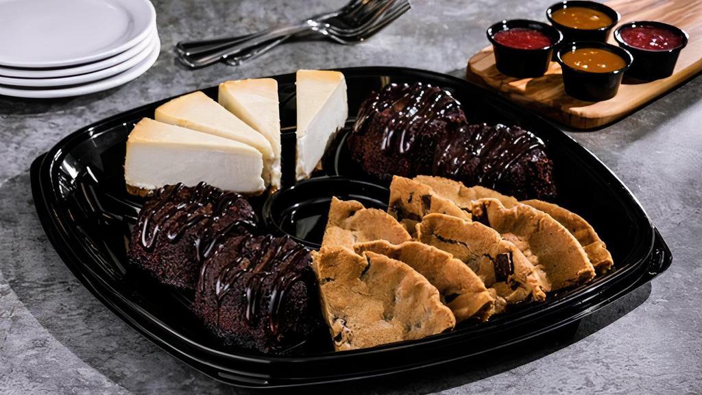 Dessert Trio · Enjoy cheesecake, oven-baked chocolate chip cookies, and our classic mini molten cakes all on one party platter. Served with strawberry puree and caramel sauce. 5570 cal.