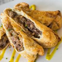 Cheese Steak Egg Rolls · thinly sliced sirloin, caramelized onions and cheese in a crispy egg roll wrapper with spicy...