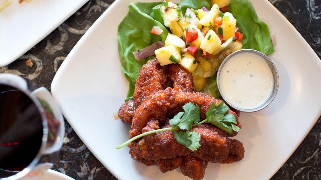Buffalo Caribbean Chicken Tenders · hand-breaded and tossed with our addictive mango-buffalo bbq sauce served with pineapple- jalapeño salsa and blue cheese dressing.