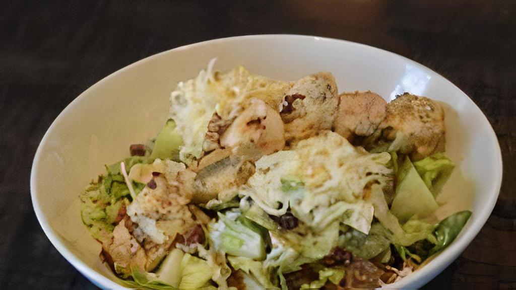 Waldorf · chopped romaine tossed with grilled chicken, dried cranberries, granny smith apples, grapes, candied pecans, smoked mozzarella with creamy sherry vinaigrette.
