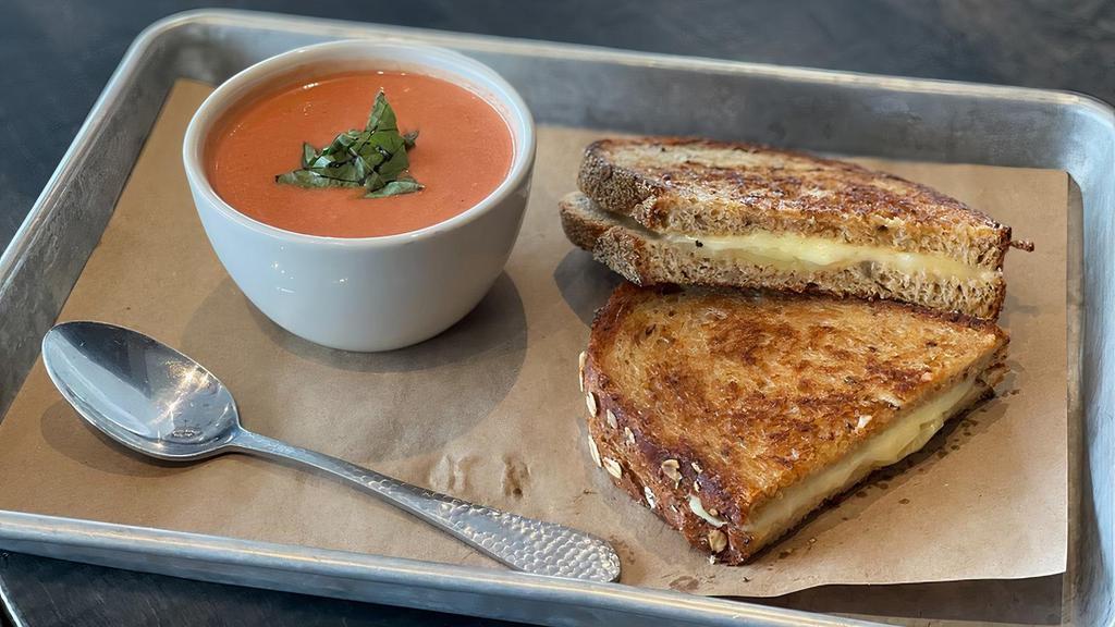 Grilled Cheese & Tomato Basil Soup · ooey gooey cheese on toasted multigrain bread with our creamy tomato soup.