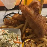 Beer Battered Fish & Chips · fried to crispy perfection served with french fries tartar sauce and coleslaw.