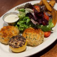 Jumbo Lump Crab Cakes · two 4oz pan-seared maryland style crab cakes with old bay potato wedges, simple green salad ...