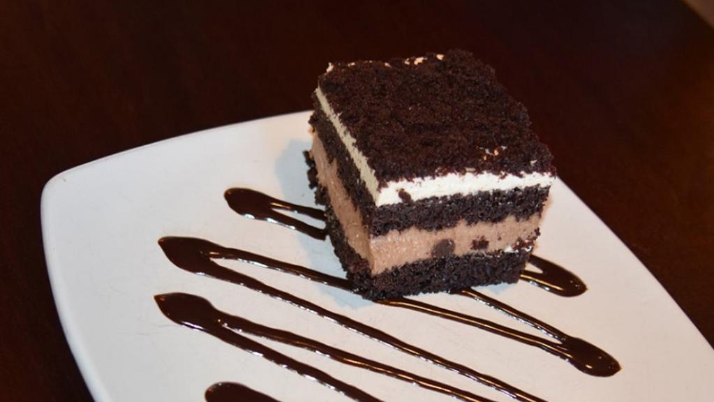 Chocolate Mousse Cake · a dreamy dessert for your inner chocoholic, rich chocolate cake layered with white and milk chocolate mousse.