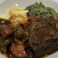 Braised Beef Short Ribs · Braised in red wine, mushrooms, onions, carrots and pomme purée.