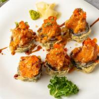 Volcano Roll · Lightly fried spicy tuna, topped with raw spicy tuna, scallion, tobiko, eel sauce, house spi...