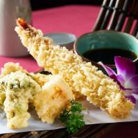 Tempura · Vegetables or seafood deep-fried in a light batter served with tempura sauce.