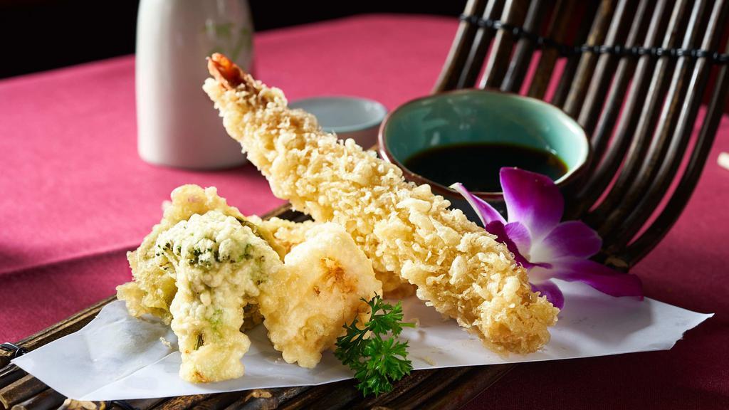 Tempura · Vegetables or seafood deep-fried in a light batter served with tempura sauce.