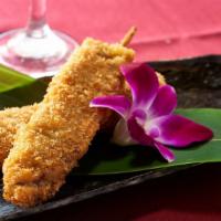 Kushi Katsu · Two skewers of cubed meat or fresh seafood deep-fried in bread crumb batter served with swee...