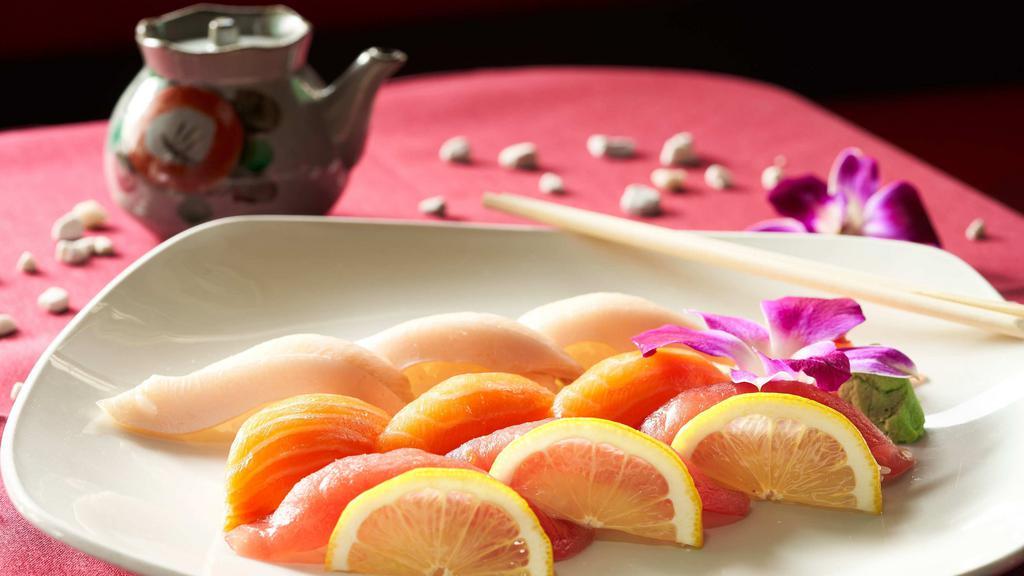 Sushi Three Kinds · Tuna sushi, salmon sushi, and yellowtail sushi.