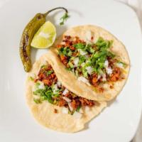 Tacos · Home made tortilla your choice of meat and they come with onion and cilantro.