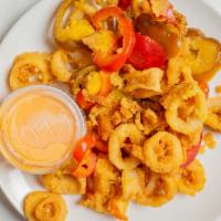 Rhode Island Calamari · Zesty fried calamari, garlic butter, sliced cherry peppers.